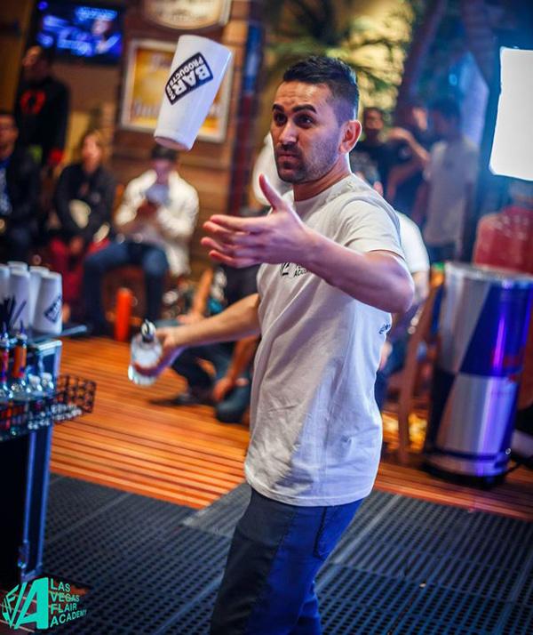 Flair Bartender using Shaker Tins during Performance